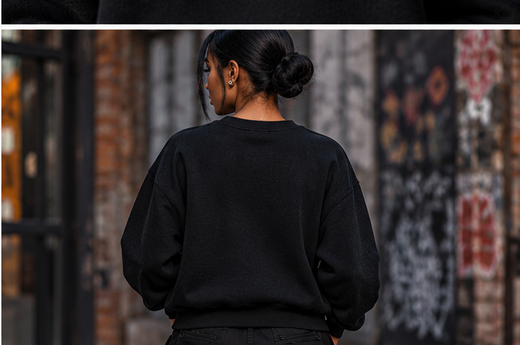 Back view of a female model wearing a plain black GET-ILL FET'S LUCK crewneck sweatshirt, showing the relaxed fit and ribbed neckline.